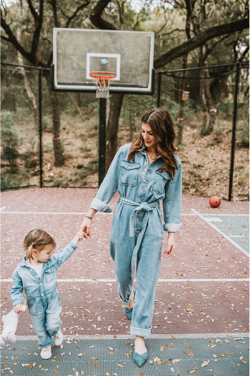 Genevieve Padalecki with daughter Odette in denim jumpsuit