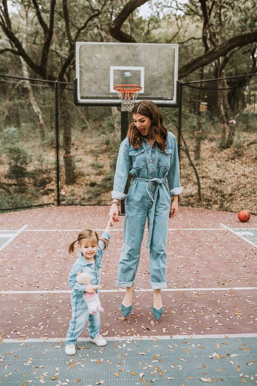 Gen and Odette in jumpsuits on a basketball field